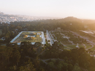 aerial drone shot sunset academy of science living roof