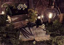 Old Books, Antique Lamp, Black Candles And Witch Herbs. Mystic Background With Ritual Esoteric Objects, Occult, Fortune Telling And Halloween Concept
