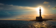 A Beautiful Night Sky Behind A Shining Lighthouse. Chania, Crete, Greece