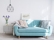 © shyrokova - Bright blue sofa in stylish home interior