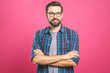 © denis_vermenko - Young man with emotions on his face with a beard on a pink background, logo, copy space.