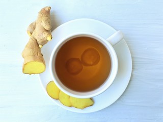 Wall Mural - Ginger tea with fresh ginger root, top view.