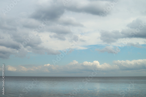 Fotografia, Obraz Gloomy blue gray sky and clouds over Lake Ladoga