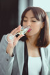 © LIGHTFIELD STUDIOS - young african american businesswoman drinking champagne from glass