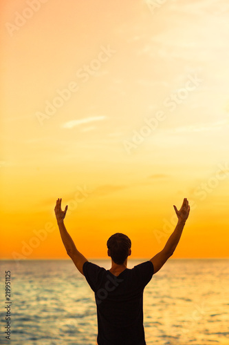 Fényképezés Happy inspired man enjoying the ocean sunset. Peace and harmony.