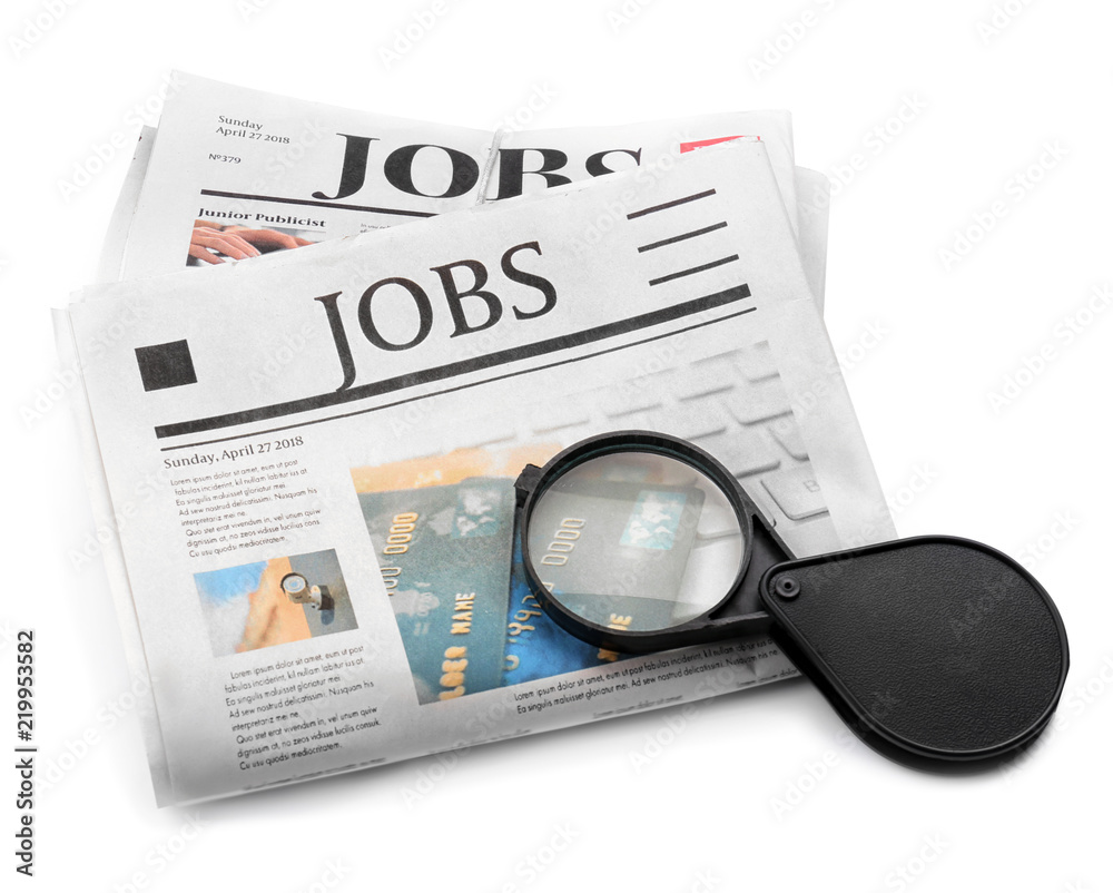 Magnifying glass with newspapers on white background