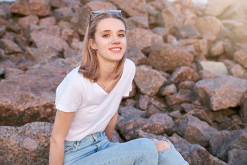 Attractive girl resting in the evening at sunset. 