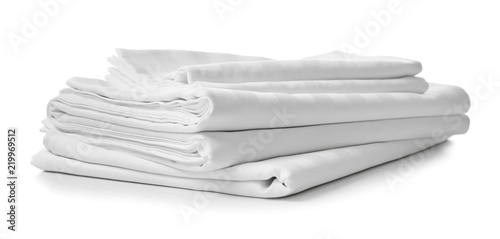 Fotografía Stack of clean bed sheets on white background