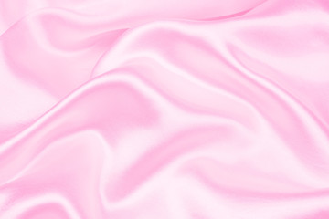 Smooth elegant pink silk or satin texture can use as abstract background. soft focus