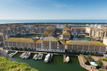 Poster - Brighton marina with homes, boats and yachts on a beautiful day in East Sussex England UK near Eastbourne 