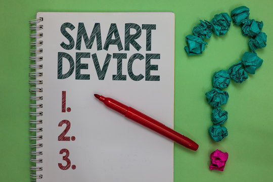 Handwriting text Smart Device. Concept meaning Electronic gadget that able to connect share interact with user Notebook marker crumpled papers forming question mark green background