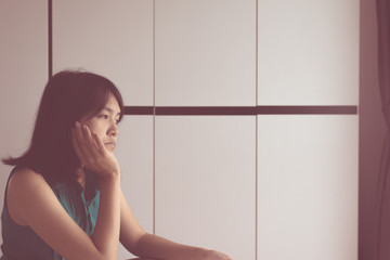 Wall Mural - Asian woman depression have a headache and feeling sadness in bedroom,Mental health care concept