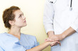 © Suthiporn - Medical professionals caucasian man reassuring and discussing with young woman worry patient.Close up and copy space.