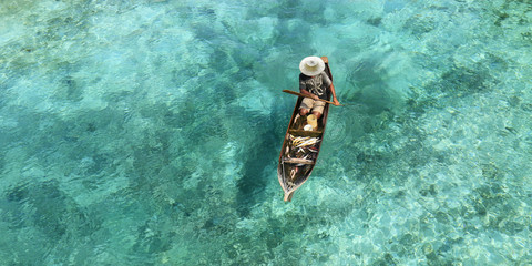 Poster - Fisherman in his boat  on turquoise sea