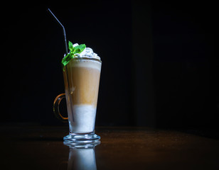 Coffee drinks on a black background. Coffee on a black table. Cold coffee. Latte. Cappuccino. Espresso. Coffee cocktails. Milkshakes. Whipped cream. Barista