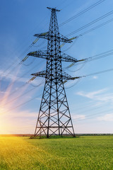 high-voltage power lines at sunset. electricity distribution station .