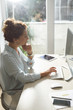© LStockStudio - Businesswoman Working on a Desktop Computer