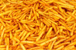 Crispy golden French fries background