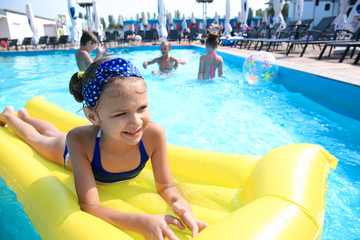 Poster - Cute girl swimming in pool on summer day