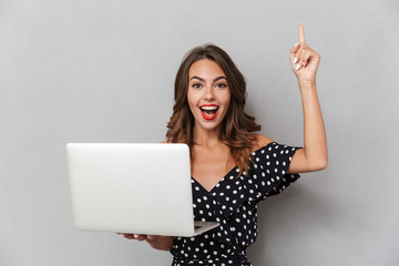 Poster - Portrait of an excited young girl in dress