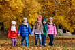 © Studio Romantic - Happy children play in the autumn in a park.