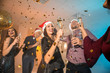 © Pixel-Shot - Young people with glasses of champagne at Christmas party