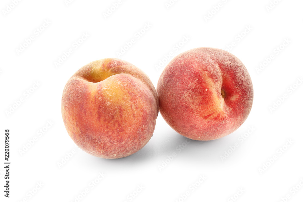 Fresh peaches on white background