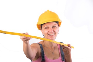 vyoung Craftsman woman with a helmet using a 
folding rule - Craftsman woman - isolated on white