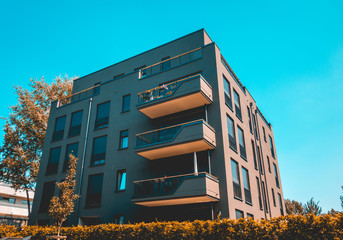 Wall Mural - dark colored apartment complex at germany