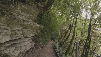 Wall Mural - tourist people hiking on mountain trail while summer travel. mountain trip