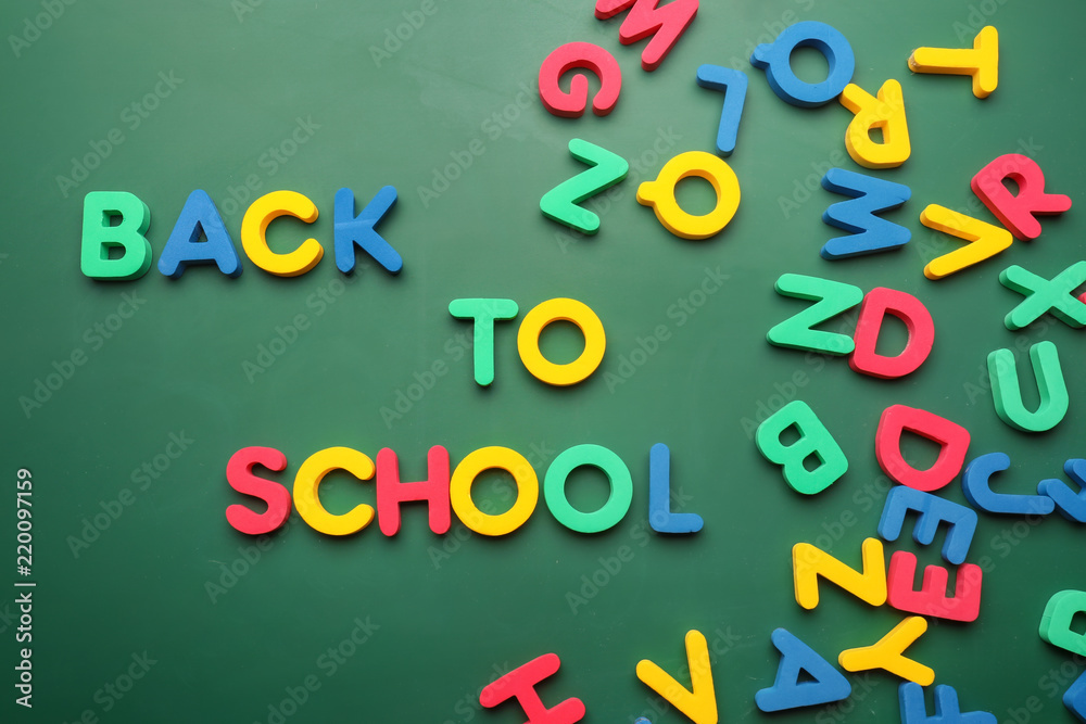 Phrase BACK TO SCHOOL made with letters on color background