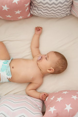 Wall Mural - Cute little baby sleeping on bed