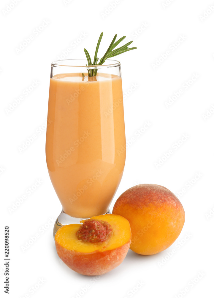 Glass with fresh peach smoothie on white background