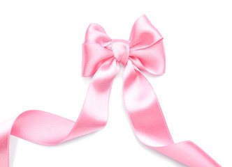 beautiful bow made from pink ribbon on white background