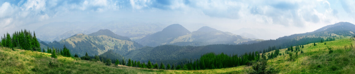 Wall Mural - view from the plain to the mountain peaks