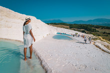 The Enchanting Pools Of Pamukkale In Turkey. Pamukkale Contains Hot Springs And Travertines, Terraces Of Carbonate Minerals Left By The Flowing Water. The Site Is A UNESCO World Heritage Site.