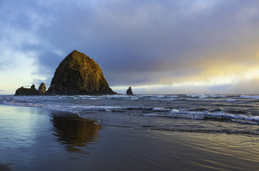 Wall Mural - Closeup of Haystack Rock in the golden light of sunset
