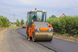 © arata70 - Work on laying of an asphalt paving by means of heavy machinery