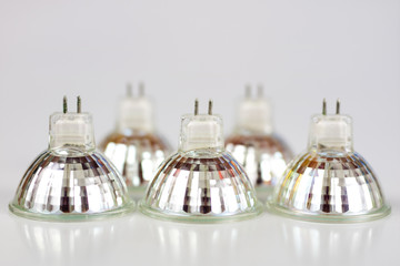 Halogen bulb on a white table. Modern interior lighting of apartment buildings.