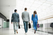 © ASDF - rear view.the business team are walking together