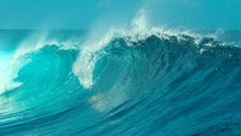 CLOSE UP: Glimmering Barrel Wave Rushes Past The Camera On A Sunny Day In Tahiti