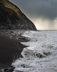 Wall Mural - Hiker on the Lost Coast Trail, racing the tide.