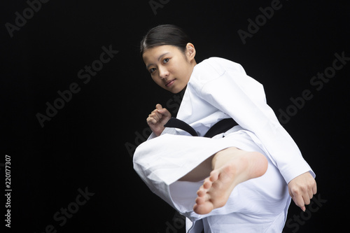 空手着を着て蹴りを繰り出す若い女性 Buy This Stock Photo And Explore Similar Images At Adobe Stock Adobe Stock