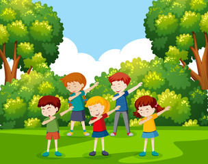 Wall Mural - A group of children dancing at the park