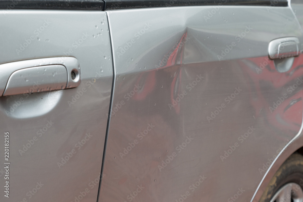 Door car with damage on accident with dent on left side - obrazy, fototapety, plakaty 