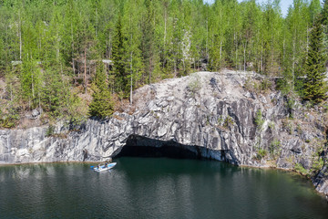 Wall Mural - The boat approaches the grotto in the career of Ruskeala, Karelia