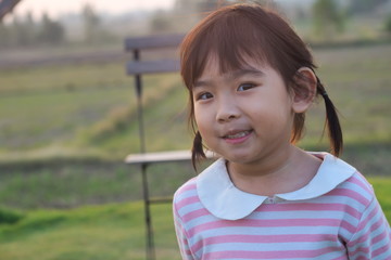 Portrait Asian cute Kid girl smiling happy