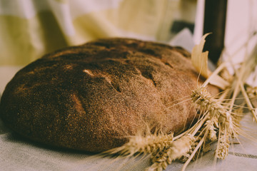 Organic sour dough loaf of bread with golden yellow sprouted wheat grains