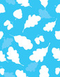 © Elena - Seamless pattern, silhouettes of the leaves of an oak and acorns on a blue background.