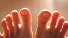 Feet With Toes Moving, Relaxing. Closeup. 4K UHD.